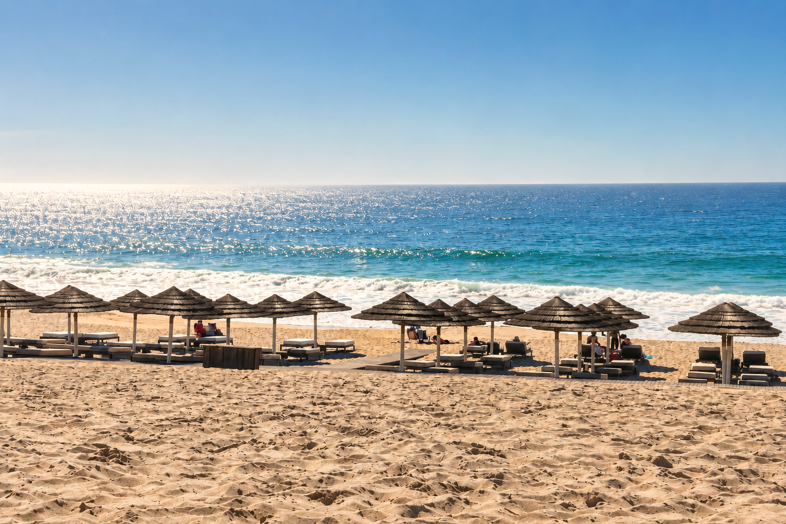 Pego Beach with Atlantic surf and beach umbrellas